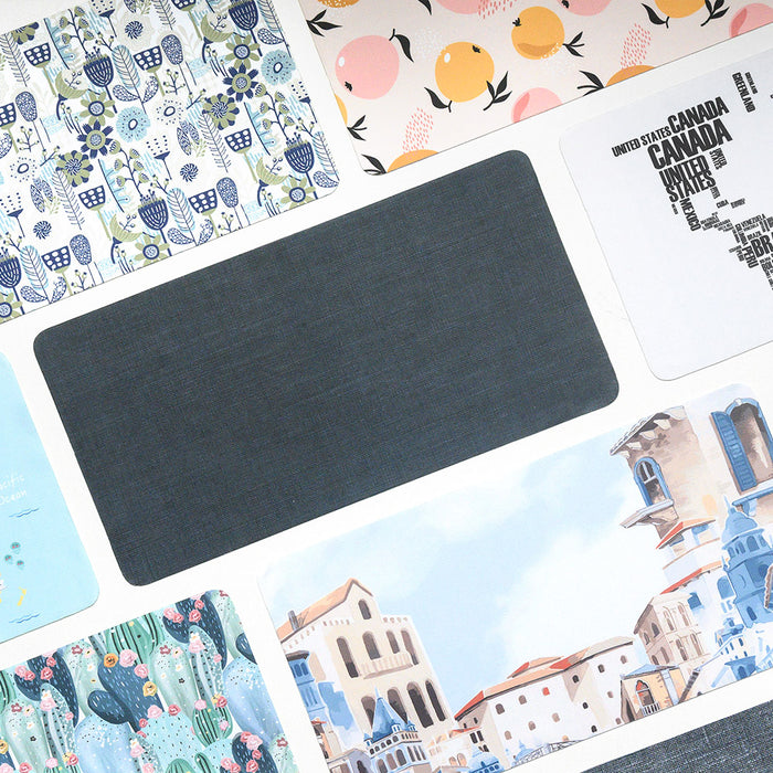 Various SenseAGE mouse pads with different designs and patterns, including floral, citrus, abstract text, and architectural illustrations, arranged in a grid layout. A plain dark-colored mouse pad is in the center.